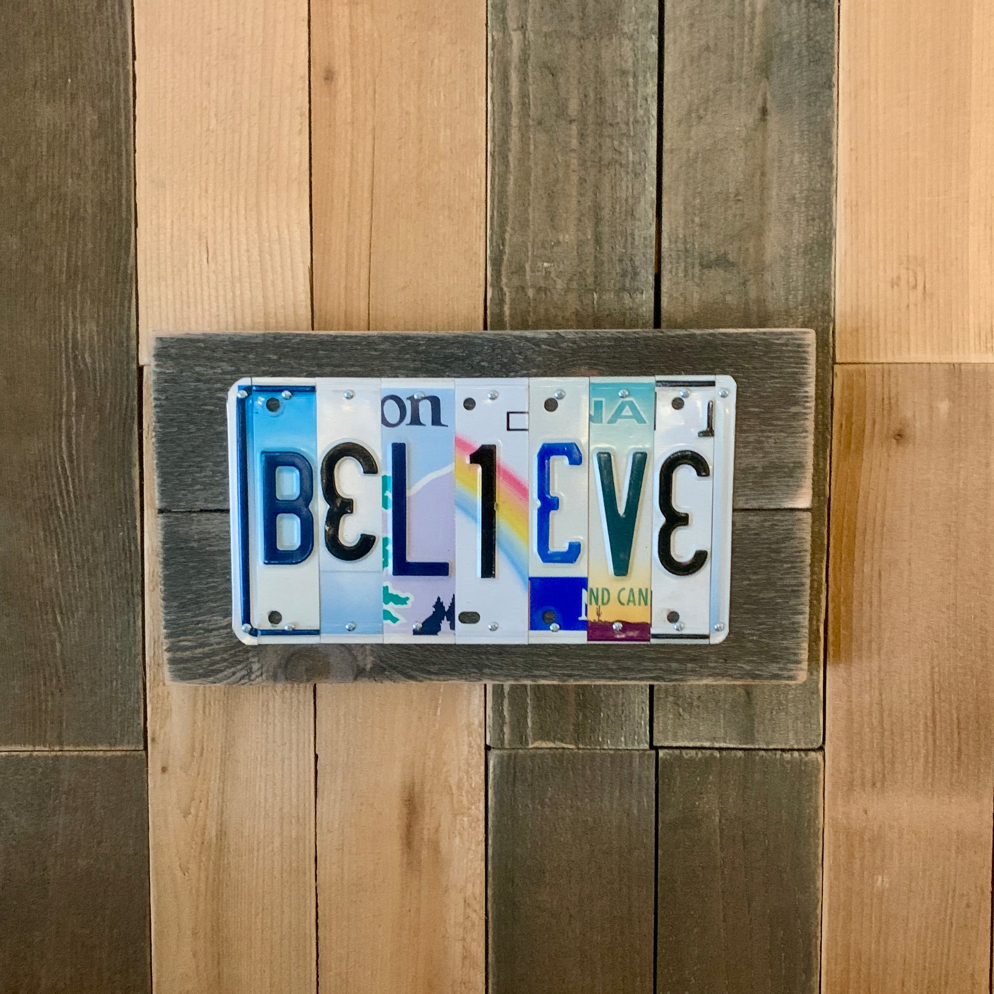 believe license plate sign with upside down 3's and E's, US license plates are cut into individual pieces to make custom wedding date, tenth anniversary traditional aluminum gift.   An artful eye paired with quality craftsmanship!  Colorful license plates!  We have developed relationships with many sources and are continually buying plates that are in good condition, have great color, and plenty of graphical interest.