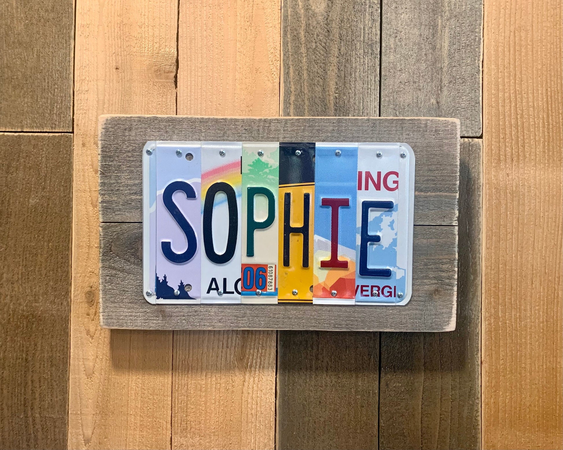 Sophie license plate sign made with license plates from Oregon, hawaii, mississippi, new york, nevada, washington state