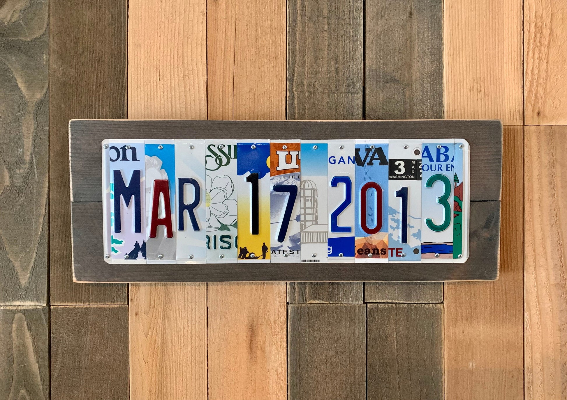 US license plates are cut into individual pieces to make custom wedding date, tenth anniversary traditional aluminum gift