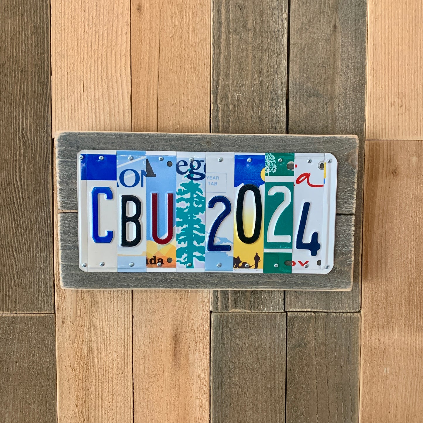 license plate sign made by cutting license plates into individual letter and number pieces to form graduate's name and graduation year.